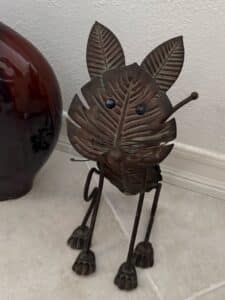 Whimsical-Metal-Leaf-Face-Cat-Sculpture