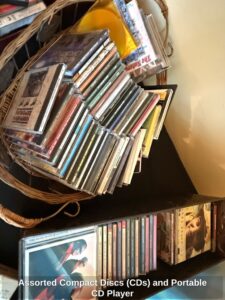 Assorted-Compact-Discs-CDs-and-Portable-CD-Player-second-image