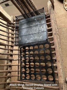 Black-Metal-Tiered-Display-Stand-with-Circular-Cutouts-second-image