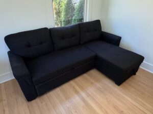 Black-Upholstered-Sectional-Sofa-with-Pull-Out-Bed-and-Storage-Chaise