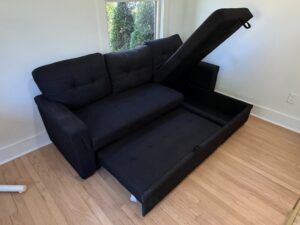 Black-Upholstered-Sectional-Sofa-with-Pull-Out-Bed-and-Storage-Chaise-second-image