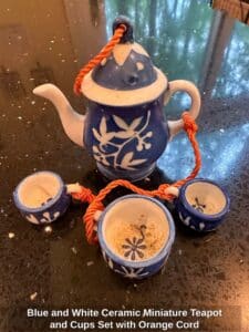Blue-and-White-Ceramic-Miniature-Teapot-and-Cups-Set-with-Orange-Cord