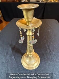 Brass-Candlestick-with-Decorative-Engravings-and-Dangling-Ornaments-second-image-1