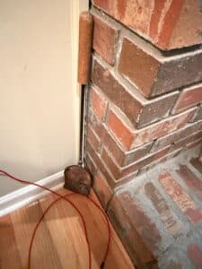Brick-Fireplace-Corner-with-Wooden-Tool