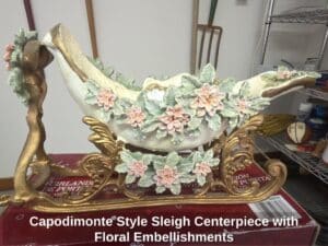 Capodimonte-Style-Sleigh-Centerpiece-with-Floral-Embellishments