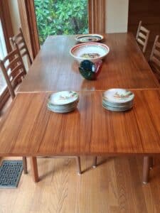 Danish-Teak-Extendable-Dining-Table-with-Chairs-and-Assorted-Tableware