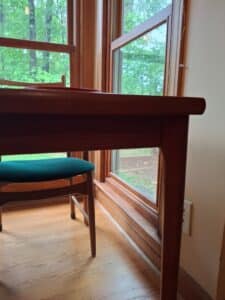 Danish-Teak-Extendable-Dining-Table-with-Chairs-and-Assorted-Tableware-fourth-image