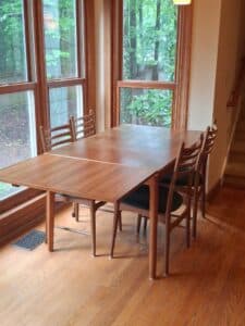 Danish-Teak-Extendable-Dining-Table-with-Chairs-and-Assorted-Tableware-second-image