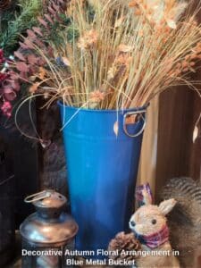 Decorative-Autumn-Floral-Arrangement-in-Blue-Metal-Bucket
