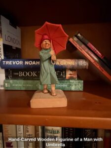 Hand-Carved-Wooden-Figurine-of-a-Man-with-Umbrella