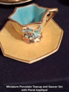 Miniature-Porcelain-Teacup-and-Saucer-Set-with-Floral-Appliqu