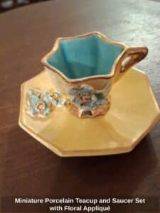 Miniature-Porcelain-Teacup-and-Saucer-Set-with-Floral-Appliqu-second-image