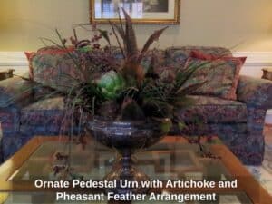 Ornate-Pedestal-Urn-with-Artichoke-and-Pheasant-Feather-Arrangement