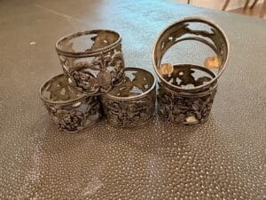 Ornate-Silver-Plated-Napkin-Rings-Set-of-with-Cherub-and-Floral-Motifs