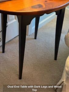 Oval-End-Table-with-Dark-Legs-and-Wood-Top