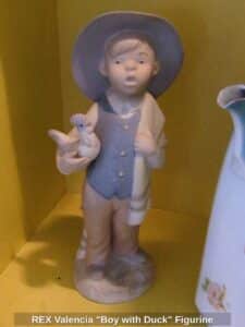 REX-Valencia-Boy-with-Duck-Figurine