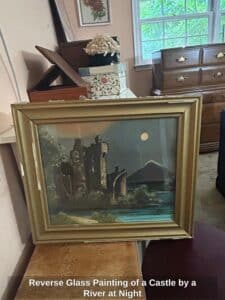 Reverse-Glass-Painting-of-a-Castle-by-a-River-at-Night