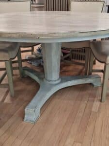Round-Pedestal-Dining-Table-with-Tapered-Legs-1