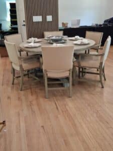 Round-Pedestal-Dining-Table-with-Upholstered-Chairs-1