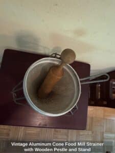 Vintage-Aluminum-Cone-Food-Mill-Strainer-with-Wooden-Pestle-and-Stand-second-image