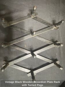Vintage-Black-Wooden-Accordion-Plate-Rack-with-Turned-Pegs