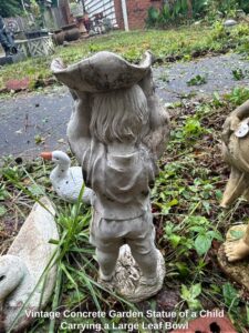 Vintage-Concrete-Garden-Statue-of-a-Child-Carrying-a-Large-Leaf-Bowl