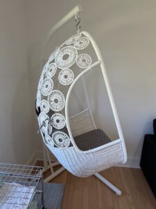 White-Wicker-Hanging-Chair-with-Geometric-Pattern-Cushions-and-Stand-second-image