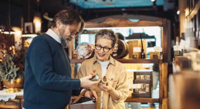 Couple exploring items while shopping at an estate sale