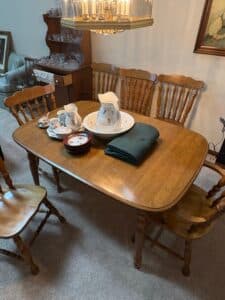 Oak-Finish-Farmhouse-Style-Dining-Set-with-Four-Spindle-Back-Chairs-third-image
