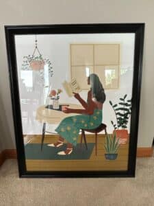 Framed-Print-of-Woman-Reading-with-Plants
