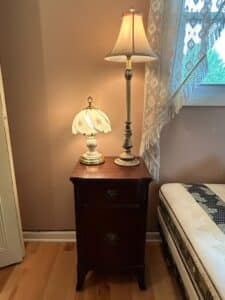 Victorian-Style-Mahogany-Nightstand-with-Floral-Ceramic-Lamp-and-Ornate-Table-Lamp