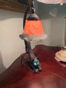 Vintage-Cast-Iron-Crouching-Cat-Lamp-with-Glowing-Green-Eyes-and-Iridescent-Glass-Shade-third-image