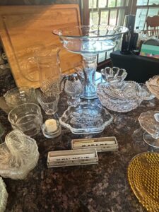 Assorted-Pressed-and-Cut-Glassware-Collection-with-Vintage-Matchbooks