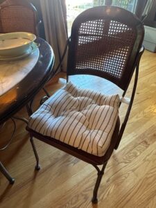 Round-Marble-Top-Dining-Table-with-Wrought-Iron-Base-and-Cane-Back-Chairs-second-image