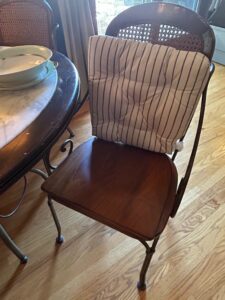 Round-Marble-Top-Dining-Table-with-Wrought-Iron-Base-and-Cane-Back-Chairs-third-image