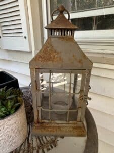 Rustic-Metal-Lantern-with-Gridwork-Glass