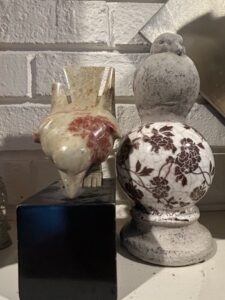 Vintage-Ceramic-Bird-Figurine-with-Transferware-Pattern-and-Carved-Stone-Bird-Sculpture