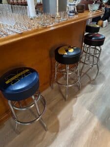 Collection-of-Four-Collegiate-and-Professional-Sports-Logo-Bar-Stools