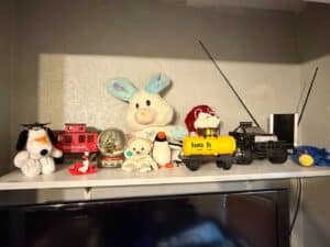 Collection-of-Plush-Toys-and-Toy-Train-Cars-including-Snoopy-Graduation-Plush-and-Santa-Fe-Tank-Car