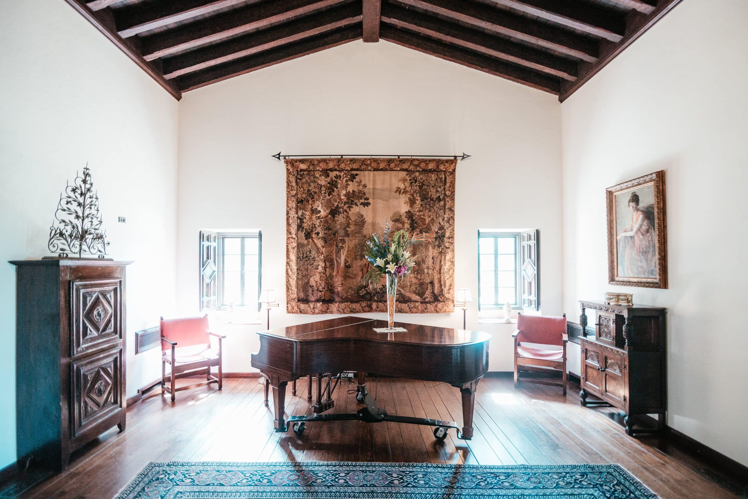 Estate home living room with grand piano and antiques prepared for an estate sale in Orlando FL