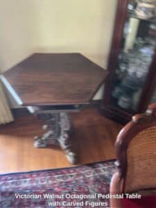 Victorian-Walnut-Octagonal-Pedestal-Table-with-Carved-Figures