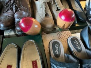 Assorted-Womens-Shoes-and-Decorative-Wooden-Spheres