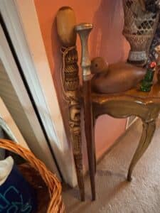 Carved-Wooden-Walking-Stick-with-Metal-Handle-and-Decorative-Carvings