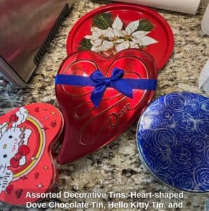 Assorted-Decorative-Tins-Heart-shaped-Dove-Chocolate-Tin-Hello-Kitty-Tin-and-Round-Poinsettia-Tin