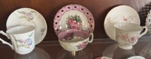 Assorted-Vintage-Porcelain-Teacups-and-Saucers-with-Floral-Motifs