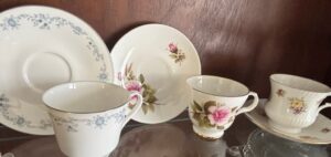 Assorted-Vintage-Porcelain-Teacups-and-Saucers-with-Floral-Motifs-third-image