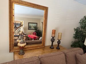 Ornate-Gold-Gilt-Mirror-with-Ribbed-Frame-and-Red-Undercoat