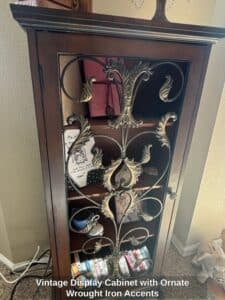 Vintage-Display-Cabinet-with-Ornate-Wrought-Iron-Accents-second-image