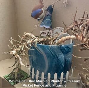 Whimsical-Blue-Marbled-Planter-with-Faux-Picket-Fence-and-Figurine