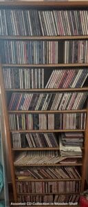 Assorted-CD-Collection-in-Wooden-Shelf